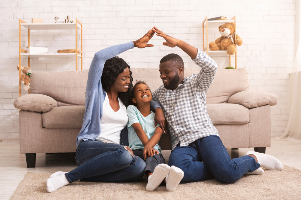 Parents and daughter in living room